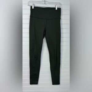 Under Armour women’s Cold Gear Compression green leggings. Size M